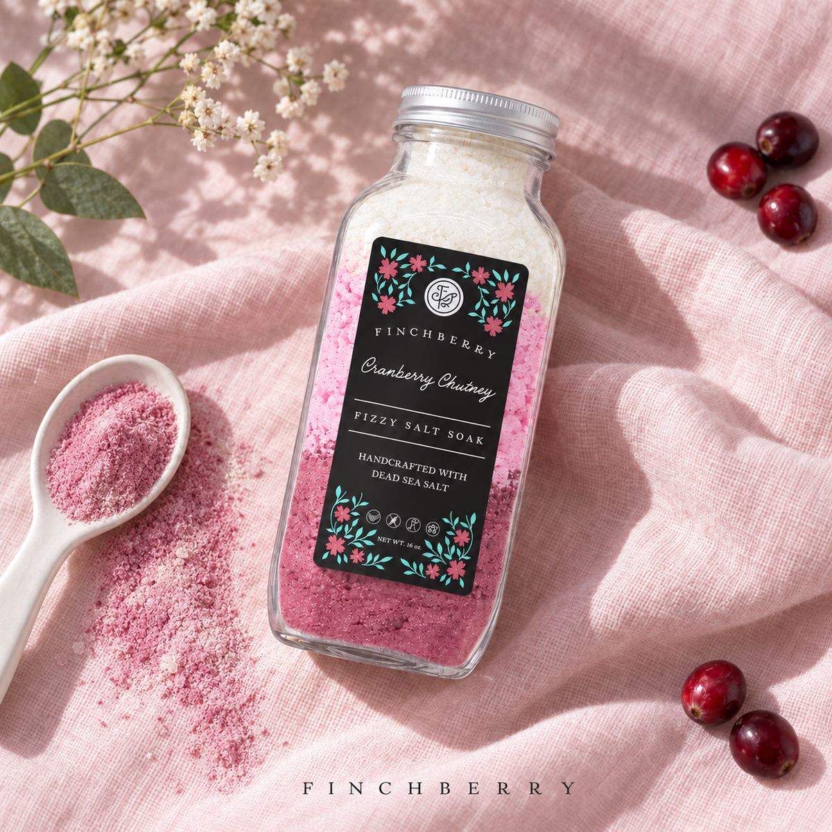 Cranberry Chutney Fizzy Salt Soak styled photograph with matching fine bath powder in a ceramic spoon